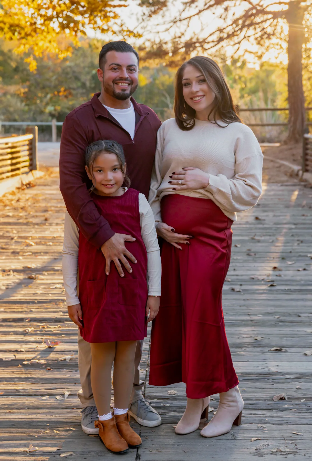 Family portrait on a boardwalk in fall colors