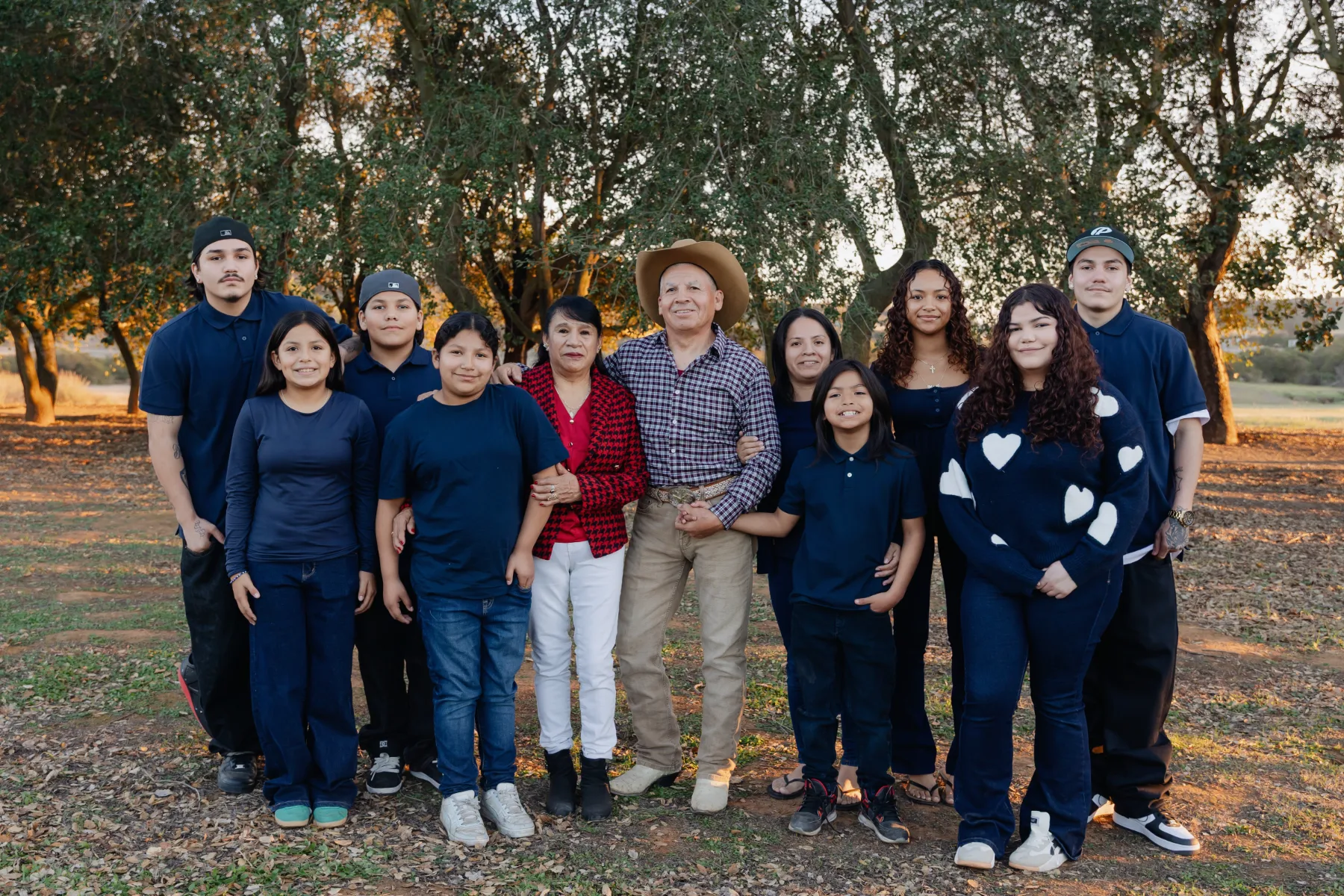 Extended family in navy and denim among the oaks, JSOLOVISUALS