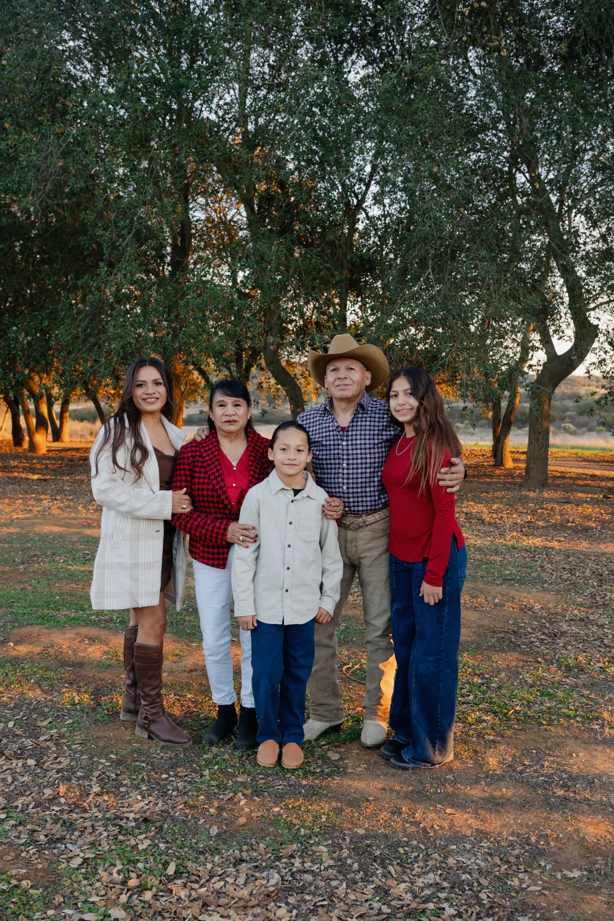 Mother, daughters and grandchildren in plaid under the oaks, JSOLOVISUALS