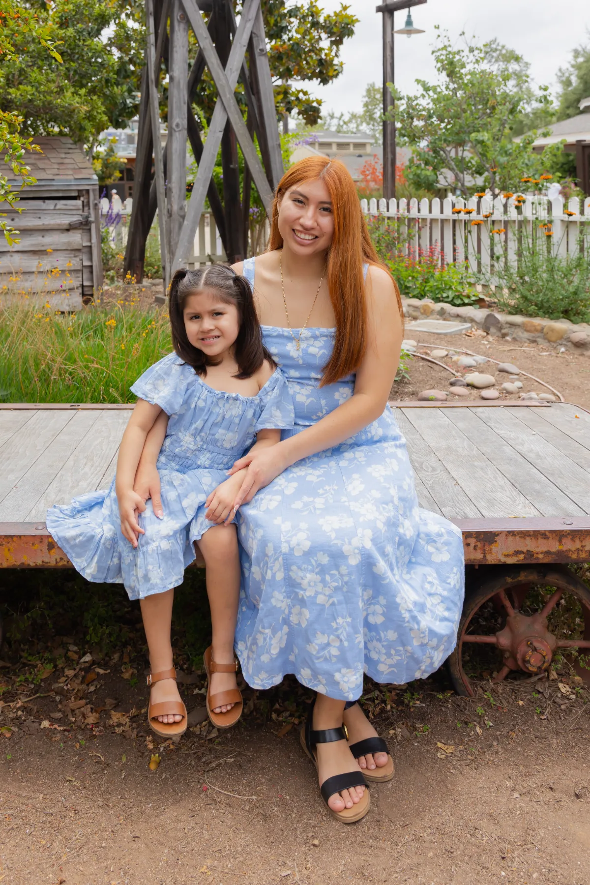 Mother and daughter in matching blue dresses, JSOLOVISUALS