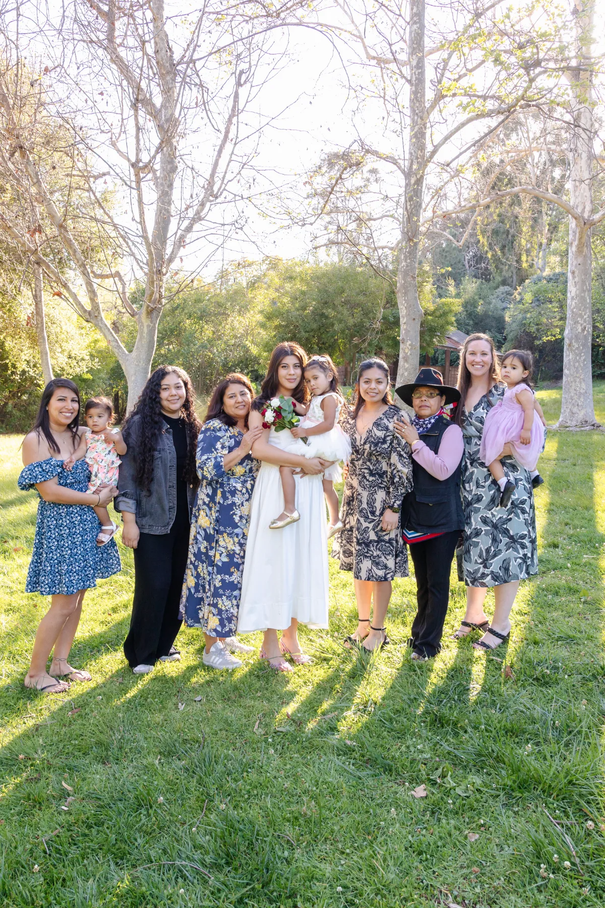 Women of the family in blue florals in a garden, JSOLOVISUALS