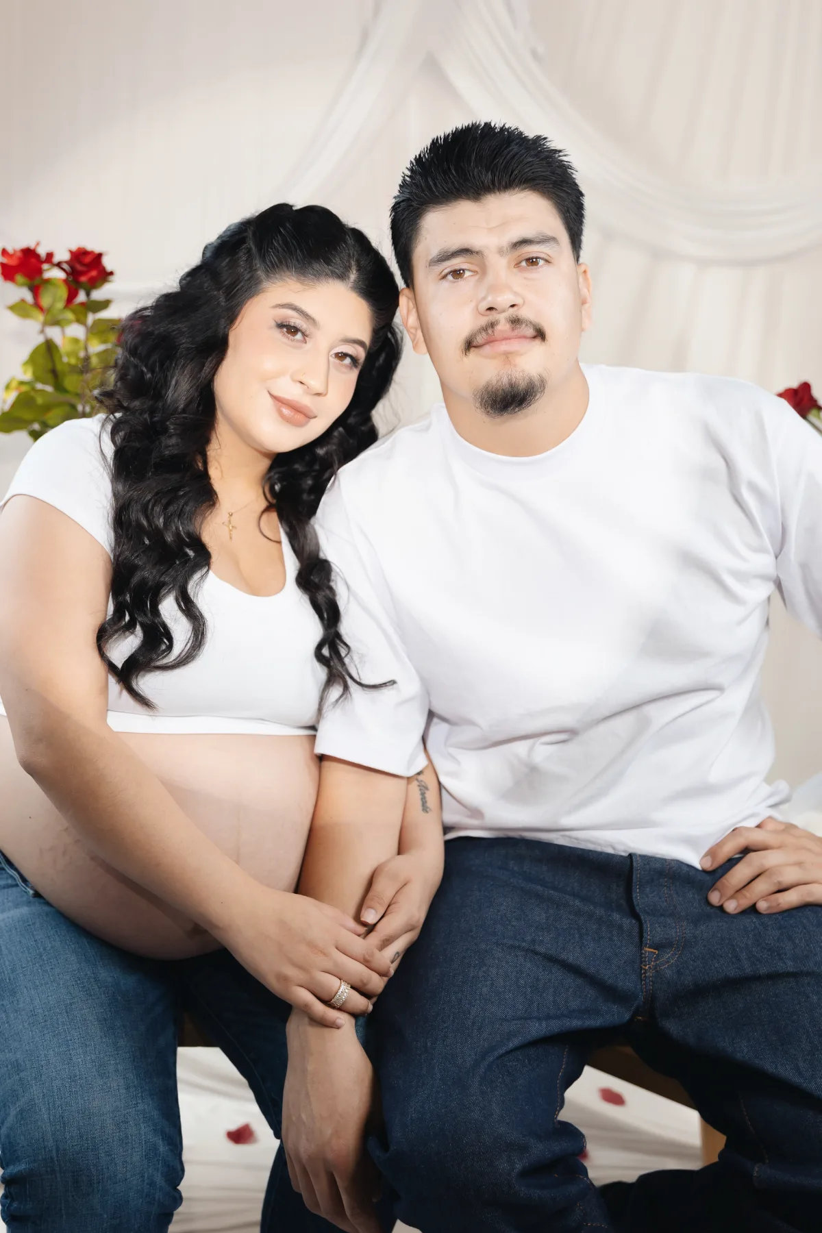 Couple maternity portrait with red roses in the JSOLOVISUALS studio, Poway