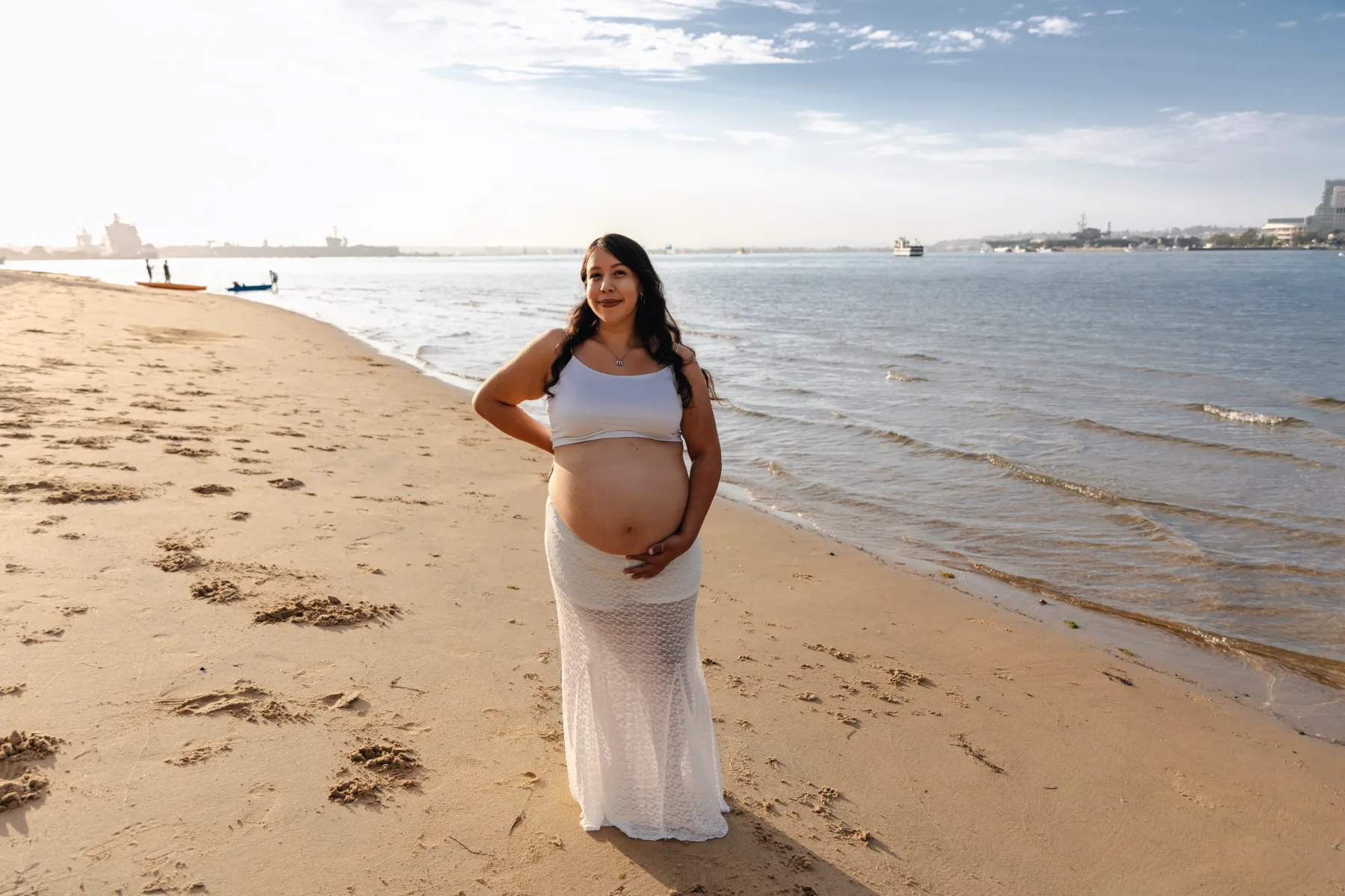 Maternity portrait on the beach in a white lace skirt, San Diego