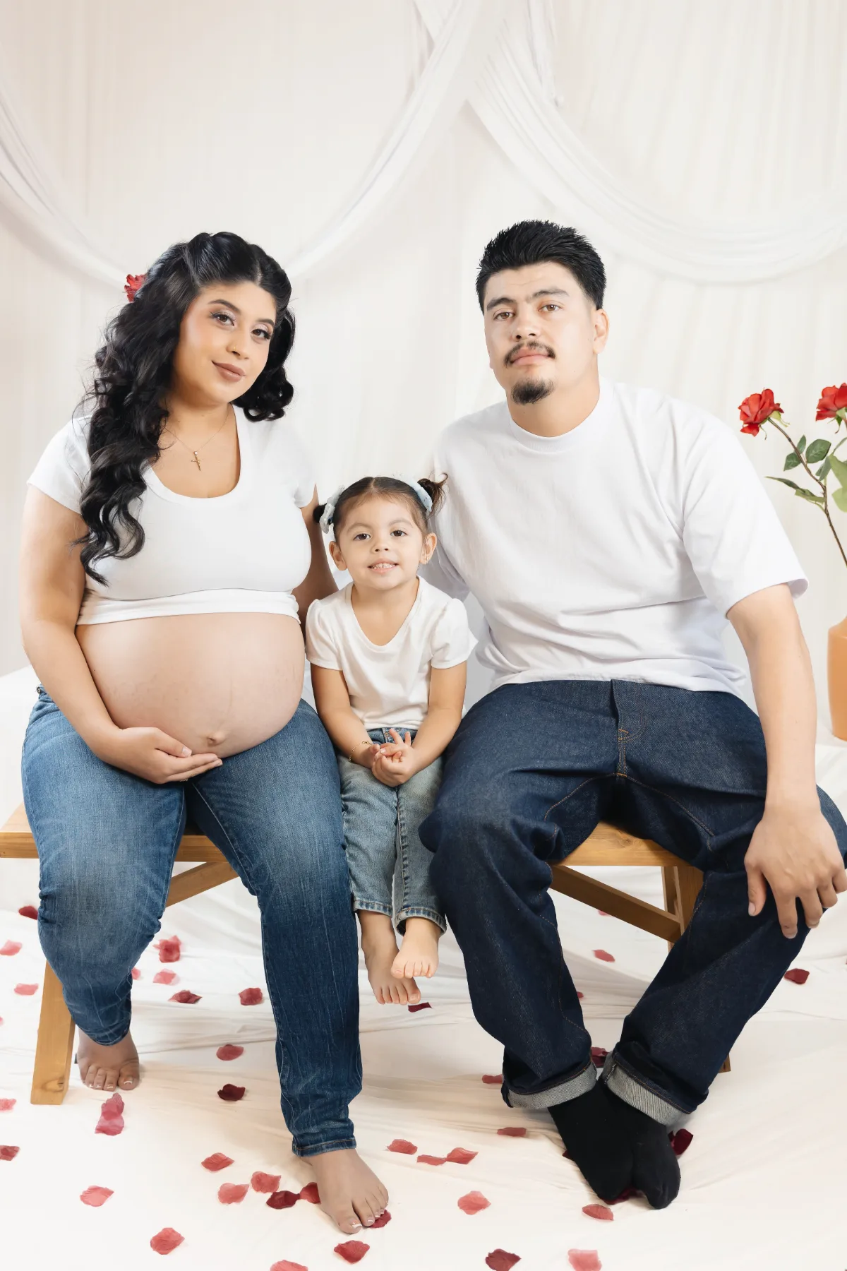 Family maternity portrait in the studio with rose petals, Poway