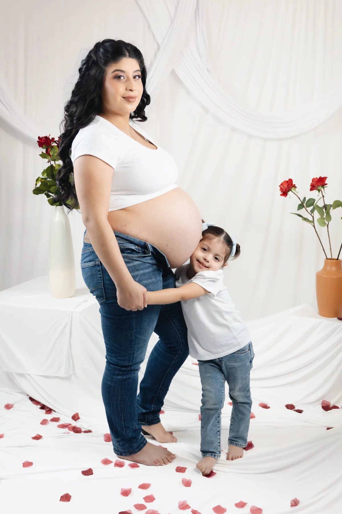 Mom and daughter maternity portrait with red roses in the Poway studio